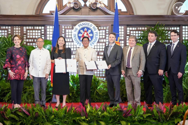 President Ferdinand R. Marcos Jr. presents Koloma with PSC 83 & 84; From left to right: U.S. Ambassador to the Philippines MaryKay L. Carlson, Secretary of Environment and Natural Resources Raphael P. M. Lotilla, Secretary of Energy Sharon Garin, President Ferdinand R. Marcos Jr., CCO Erik Scher, CXO Tim Chisholm, CTO Tom Darrah, and Dir. Sam Morton